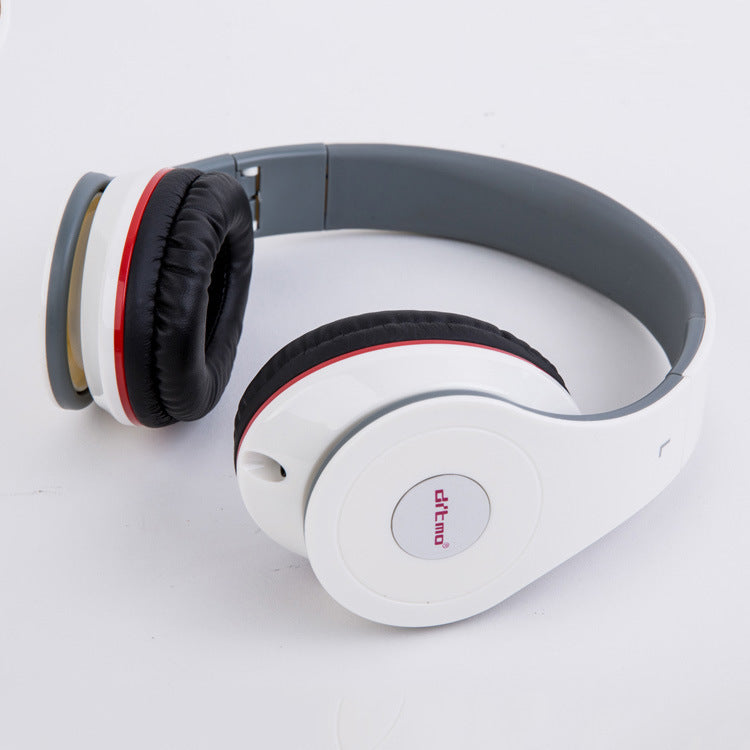 White wired on-ear gaming headphones with black cushioned ear pads and red accent on light background